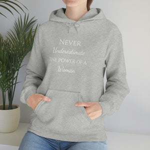 Never Underestmate the Power of a Woman Unisex Heavy Blend™ Hooded Sweatshirt