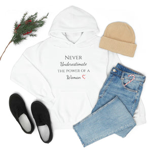 Never Underestmate the Power of a Woman Unisex Heavy Blend™ Hooded Sweatshirt