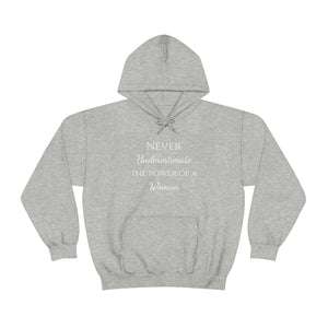 Never Underestmate the Power of a Woman Unisex Heavy Blend™ Hooded Sweatshirt