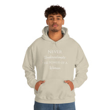 Load image into Gallery viewer, Never Underestmate the Power of a Woman Unisex Heavy Blend™ Hooded Sweatshirt