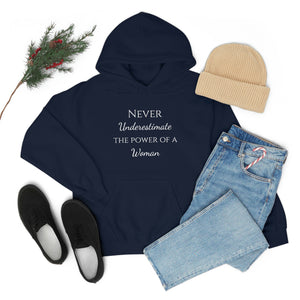 Never Underestmate the Power of a Woman Unisex Heavy Blend™ Hooded Sweatshirt