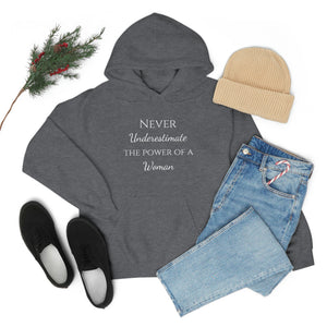 Never Underestmate the Power of a Woman Unisex Heavy Blend™ Hooded Sweatshirt