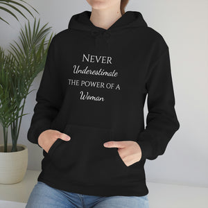 Never Underestmate the Power of a Woman Unisex Heavy Blend™ Hooded Sweatshirt