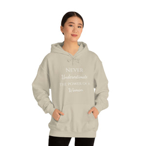 Never Underestmate the Power of a Woman Unisex Heavy Blend™ Hooded Sweatshirt