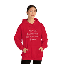 Load image into Gallery viewer, Never Underestmate the Power of a Woman Unisex Heavy Blend™ Hooded Sweatshirt