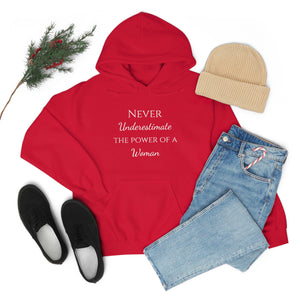 Never Underestmate the Power of a Woman Unisex Heavy Blend™ Hooded Sweatshirt